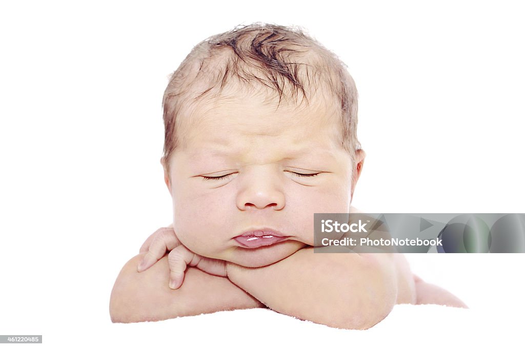 Newborn baby sleeping on white background